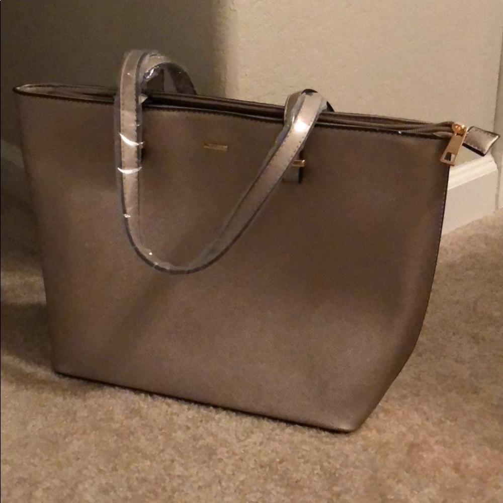 Large purse with smaller clutch.